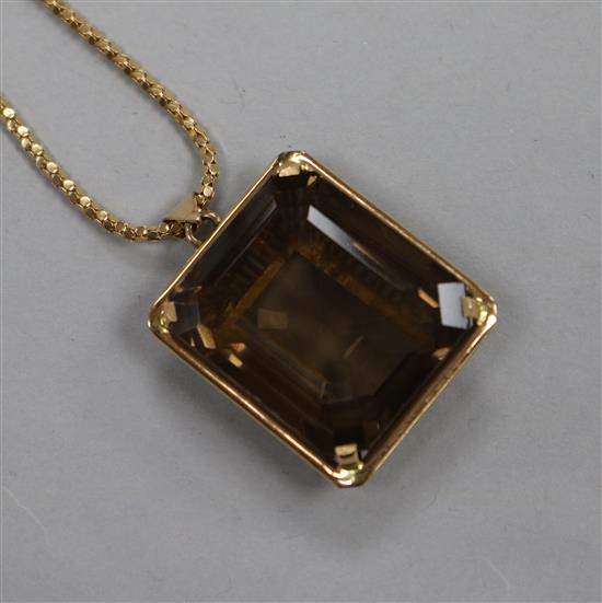 A continental yellow metal mounted smoky quartz pendant, on an 18ct gold chain, pendant 29mm.